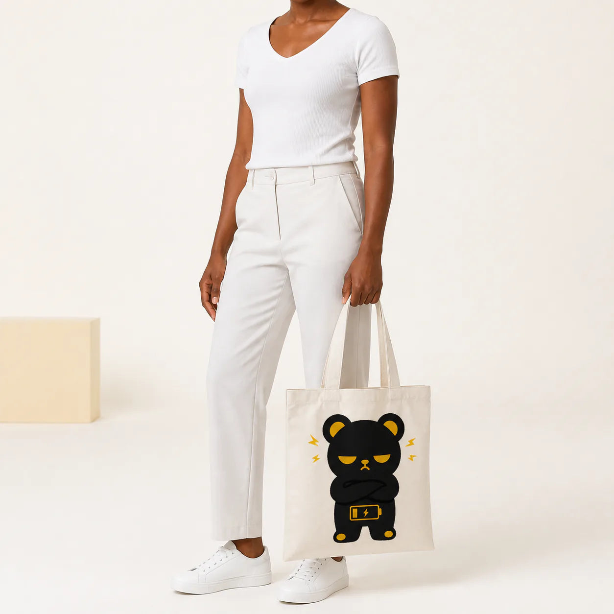 Woman carrying a custom canvas tote bag by hand